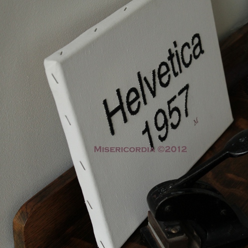 Helvetica hand embroidered canvas - Misericordia 2012